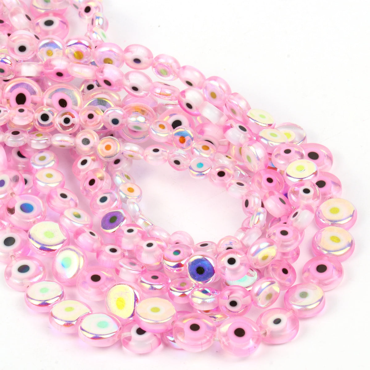 Overlapping strands of pink flat round evil eye beads with rainbow reflections