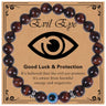 Glossy reddish brown banded bead bracelet with a blue eye bead and silver tone spacers on a printed card