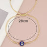 Blue evil eye cord bracelet with a circular measurement guide labeled 28 cm
