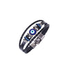Black bracelet with twin braided strands, a round blue evil eye centerpiece and a hook-and-slot clasp on a white background.