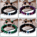 Four bracelet styles with blue eye centers: glossy black, banded purple, striped green and matte black