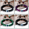 Four bracelet styles with blue eye centers: glossy black, banded purple, striped green and matte black