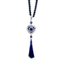 Heart-shaped blue evil eye ornament with a black bead loop, silver tone frame and blue tassel