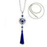Heart-shaped blue evil eye ornament with white beads and a blue tassel; inset shows the bead loop