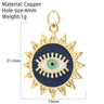 Sunburst evil eye charm with a navy blue face, turquoise center and gold tone rays, shown with measurement annotations