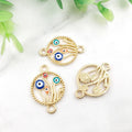 Gold tone floral circle connectors with multicolored eye motifs on curved stems, shown from the front and back.