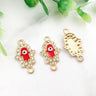 Gold tone Hamsa connectors with red inner hands and central eyes, shown from the front and back.