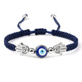 Blue cord bracelet with a central blue eye between two silver tone Hamsa hands