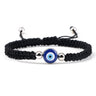 Black knotted cord bracelet with one round blue eye and silver tone beads