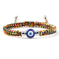 Multicolored knotted cord bracelet with one round blue eye and silver tone beads