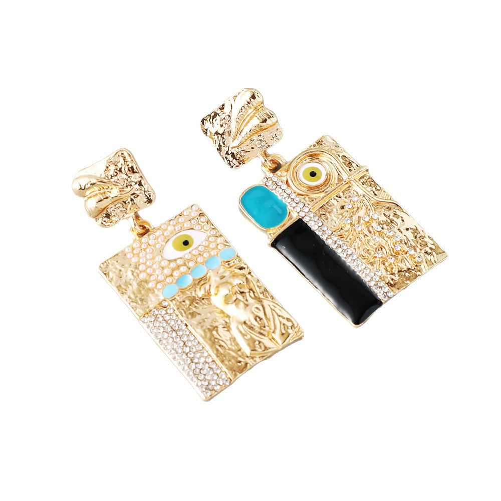 Gold evil eye earrings with turquoise accents