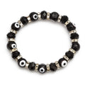 Black evil eye bracelet with rounded eye beads, faceted beads and silver tone spacer rings
