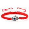 Red braided bracelet with a dotted silver tone Hamsa hand and blue eye