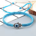 Turquoise braided Hamsa bracelet with a blue eye and beaded cord ends