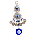 Two silver tone scrollwork eye medallions with blue beads, coin charms and a round blue eye pendant