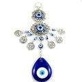 Two silver tone eye medallions with blue beads, coin charms and a blue teardrop pendant