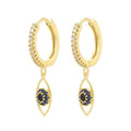 Gold tone hoops with clear accents and vertical open eye charms with black centers and blue accents