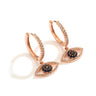 Rose gold tone hoop earrings with clear accents and open eye charms surrounding blue and dark centers