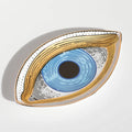 Blue linework eye tray with a broad gold tone outline, viewed at an angle