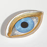 Blue linework eye tray with a broad gold tone outline, viewed at an angle