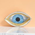 Blue eye tray with fine linework, a broad gold tone outline and a dotted border, front view