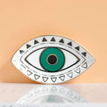 Green eye tray with black triangular border details and a gold tone rim, front view