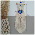 Long-fringe evil eye wall hanging with image annotations reading 8 cm across the top bar, 4 cm across the pendant and 28 cm vertically.