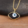 Close-up of the Black necklace option, with a white and blue eye center and gold tone pendant border and chain.
