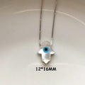 White Hamsa hand evil eye pendant on a silver tone chain, shown with a 12 × 16 mm annotation.