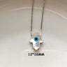 White Hamsa hand evil eye pendant on a silver tone chain, shown with a 12 × 16 mm annotation.