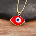 Close-up of the Red necklace option, with a white and blue eye center and gold tone pendant border and chain.