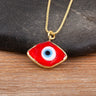 Close-up of the Red necklace option, with a white and blue eye center and gold tone pendant border and chain.