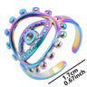 Rainbow evil eye ring with an open band and a printed measurement annotation reading 1.7 cm and 0.67 inch.
