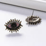 Pink evil eye earrings shown from the front and back, with a straight stud post visible