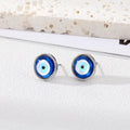 Pair of blue evil eye stud earrings with silver tone rims