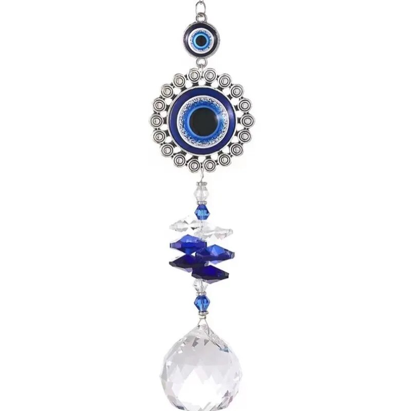 Round blue evil eye suncatcher with a silver tone ring border, stacked blue accents and a clear faceted ball on white