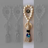 Tan evil eye tassel with a black wrap and blue eye bead, highlighted as Style F