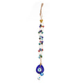 Several tan strands with multicolored eye beads leading to a blue teardrop pendant and lower eye drops