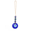 Round blue evil eye pendant beneath a grey-blue faceted oval bead, two eye beads and silver tone spacers