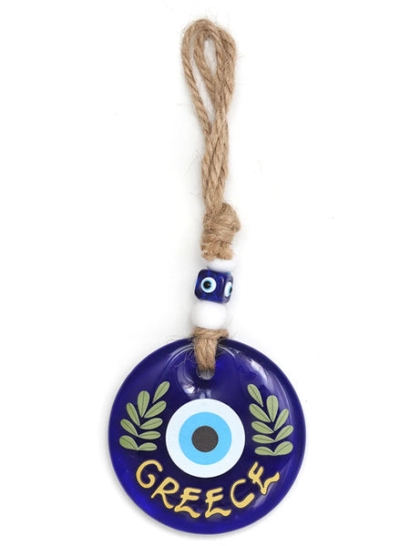 Blue evil eye wall hanging with green leafy branches, GREECE lettering and a beaded rope loop