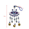 Blue evil eye wall hanging with measurement guides for the ornament, eye centerpiece and cord loop