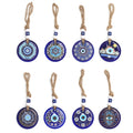 Eight blue evil eye wall hanging designs arranged in two rows, each with a round patterned disc and beaded rope loop