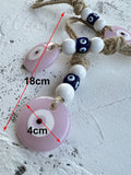 Pink round evil eye pendants with white beads and blue cube beads, with 18 cm and 4 cm annotations