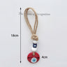 Red evil eye hanging with two white beads and a blue cube bead, with 18 cm and 4 cm annotations