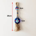 Tassel evil eye wall hanging with image annotations reading 26 cm overall, 3 cm at the upper eye and 4 cm at the lower disc