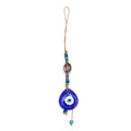 Blue teardrop evil eye hanging with a purple oval bead, silver tone spacers and uneven blue and turquoise bead ends