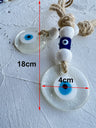Clear round evil eye pendants with blue cube beads and tan cord, with 18 cm and 4 cm annotations