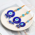 Three blue evil eye hangings with turquoise upper eyes and different cube and faceted bead fringes
