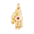 Gold tone curved hand pendant with a white eye, red center and ring at the wrist