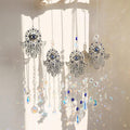Four silver tone Hamsa suncatcher designs displayed together with ball, star, moon and blue-eye pointed drops.